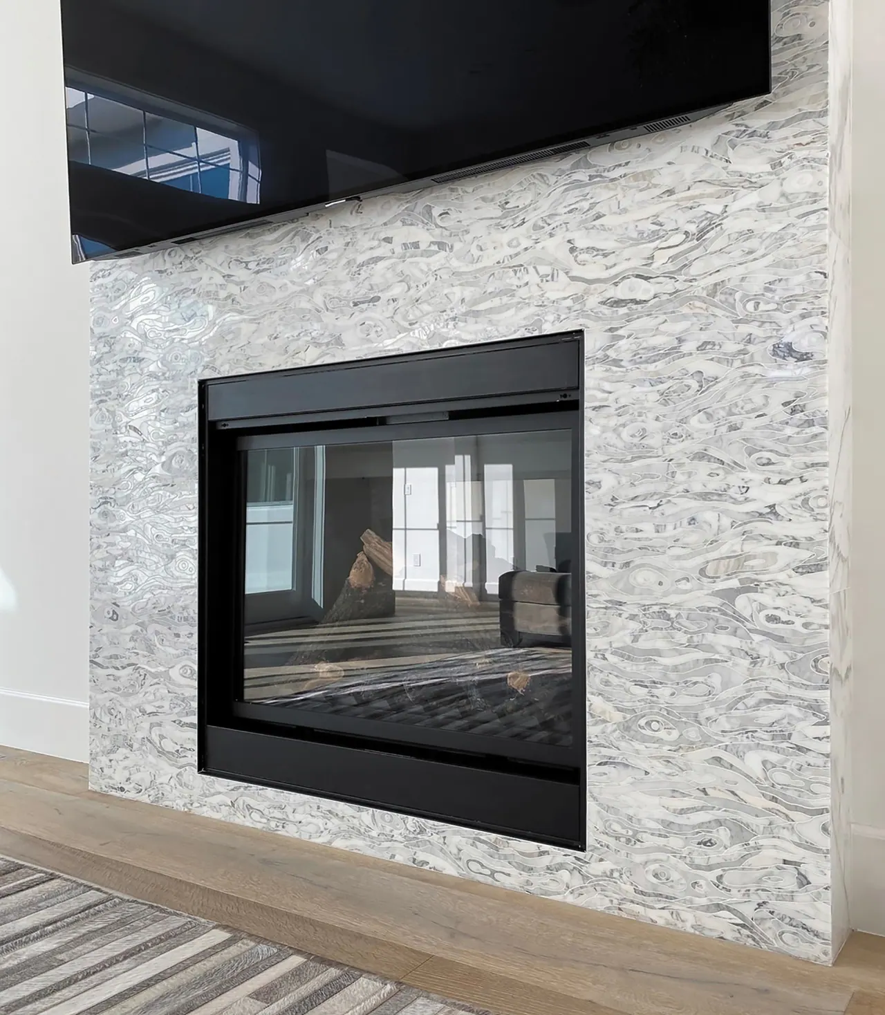 Modern fireplace with herringbone pattern tile
