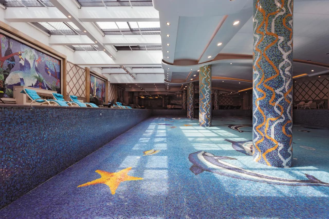 Resort-style outdoor pool with stone surround